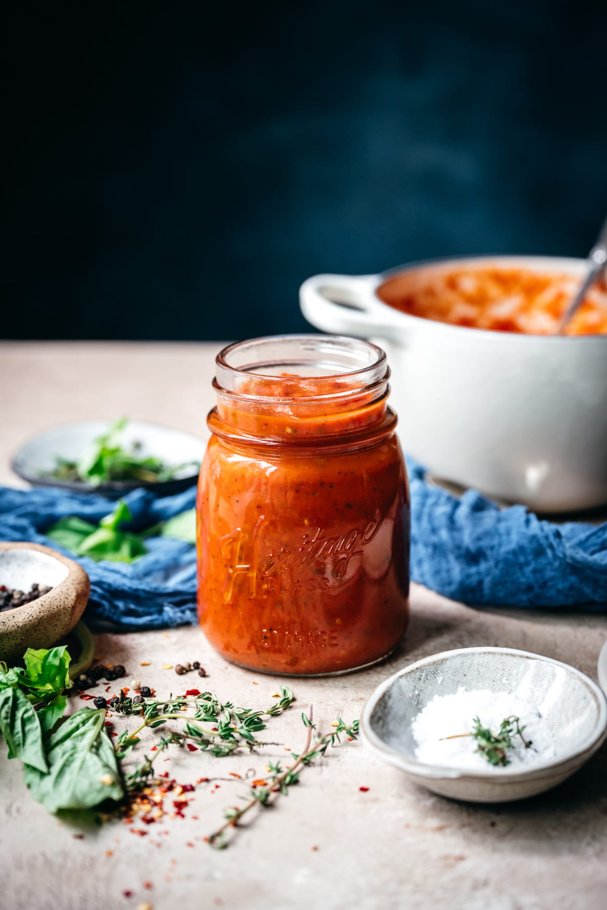 side view of homemade tomato sauce in a jar