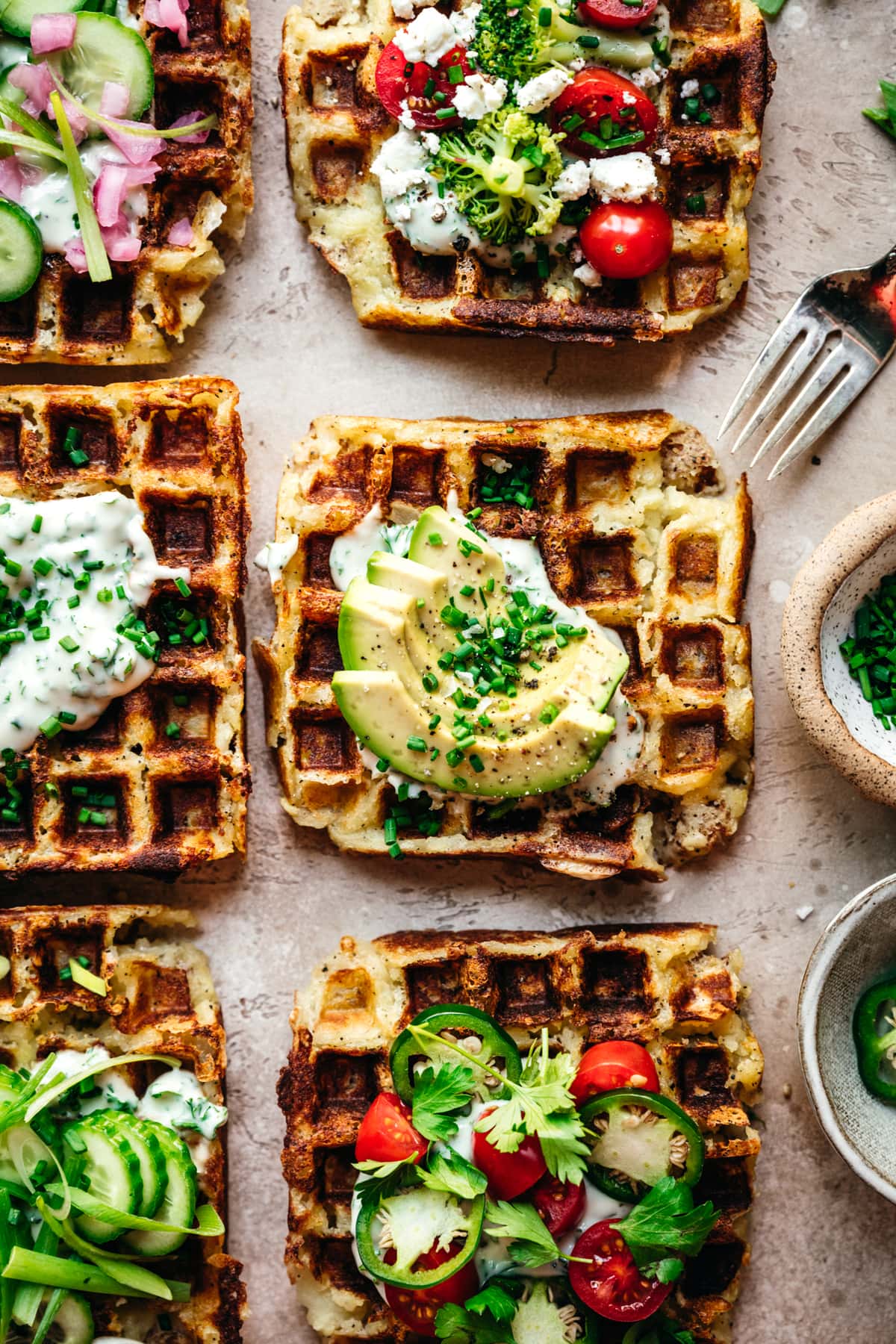 overhead view of mashed potato waffles with savory toppings