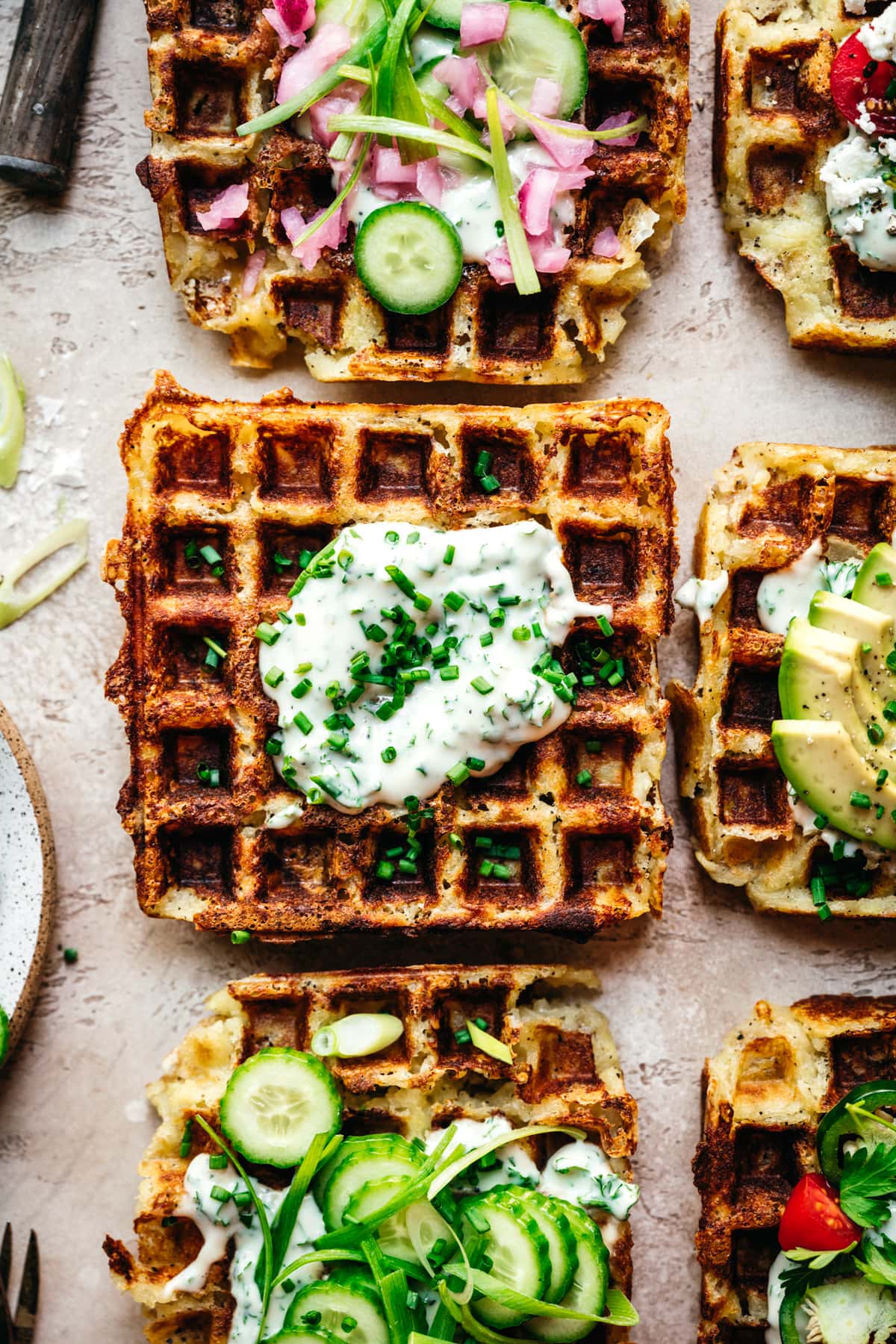 overhead view of savory mashed potato waffle with herb yogurt sauce