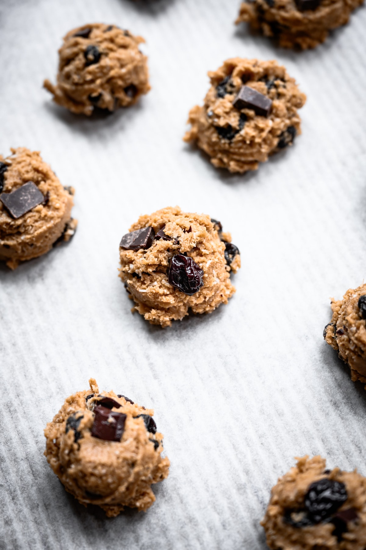 oatmeal dark chocolate cherry cookie dough on baking sheet