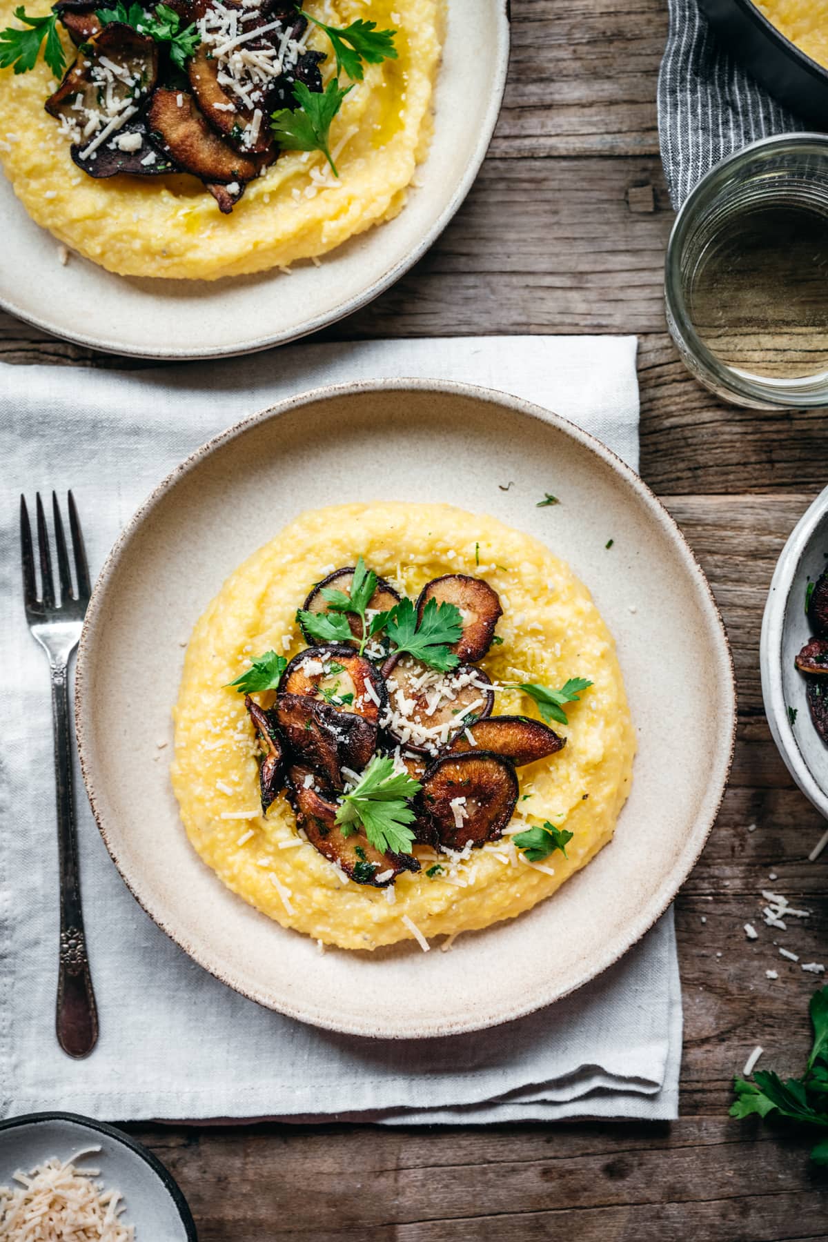 overhead view of bowl of creamy vegan polenta with mushrooms