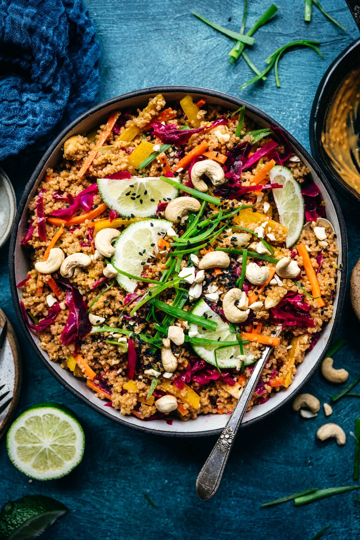 overhead view of thai quinoa salad with crunchy vegetables and peanut sauce