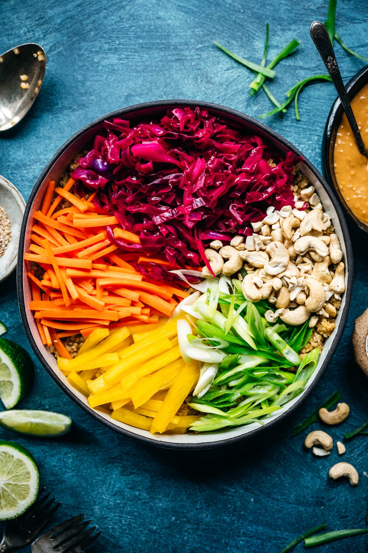 overhead view of ingredients for vegan thai quinoa salad with rainbow vegetables 