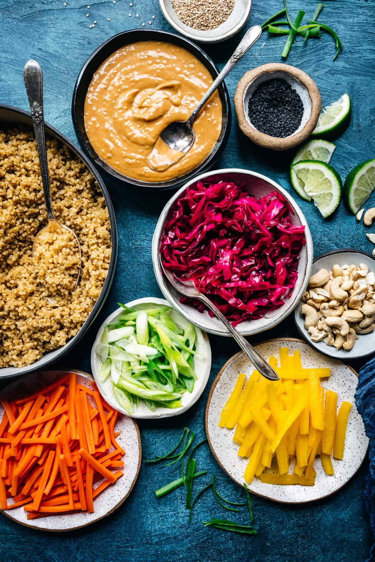 overhead view of colorful vegetable ingredients for thai quinoa peanut salad