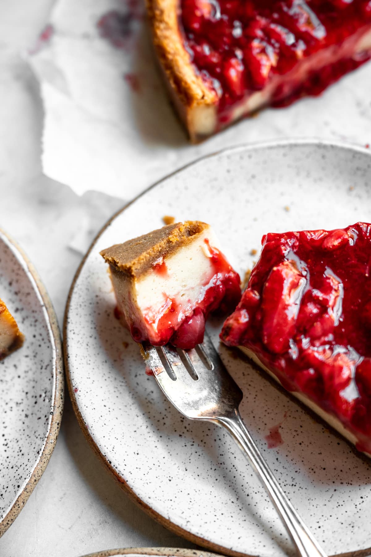 close up view of baked vegan cheesecake on a fork