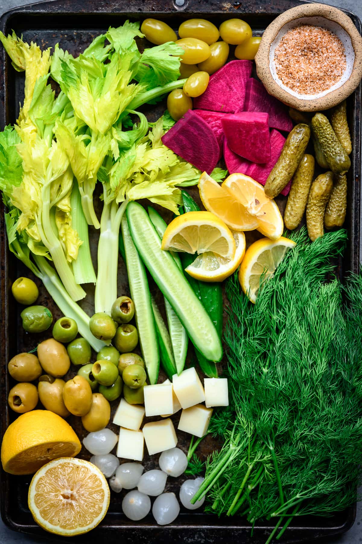 overhead view of tray with bloody mary topping ingredients