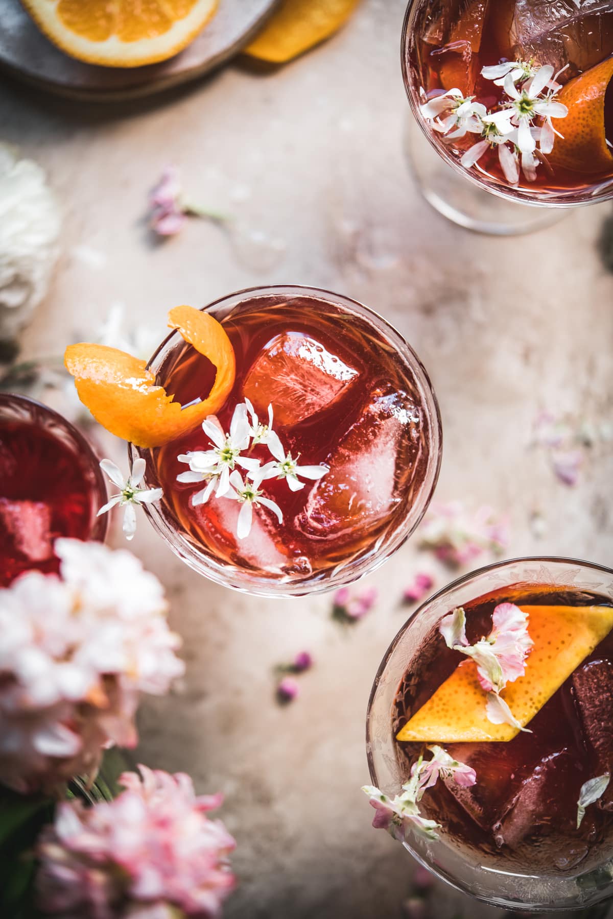 overhead view of cherry negroni with orange peel