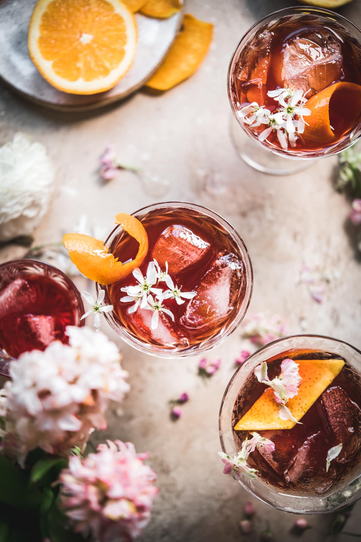 overhead view of cherry negroni with orange peel