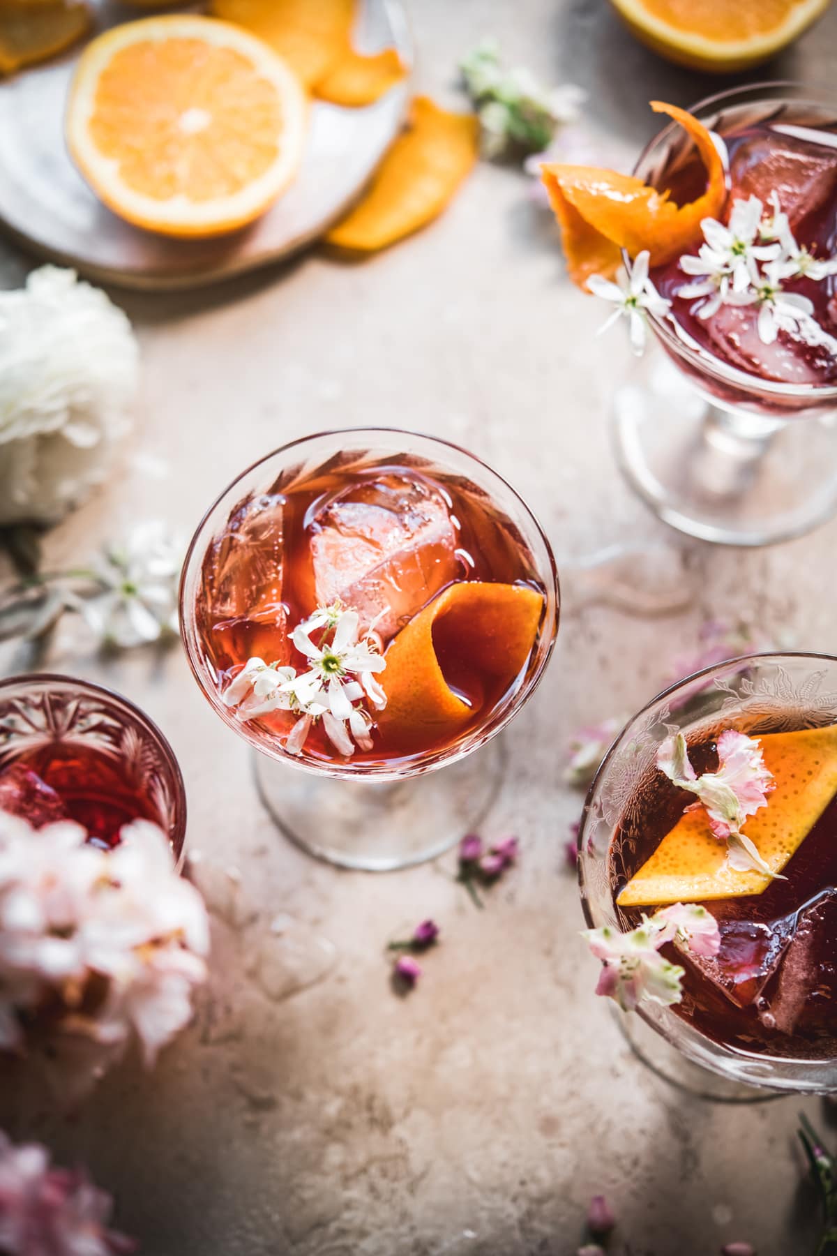 overhead view of cherry negroni with orange peel