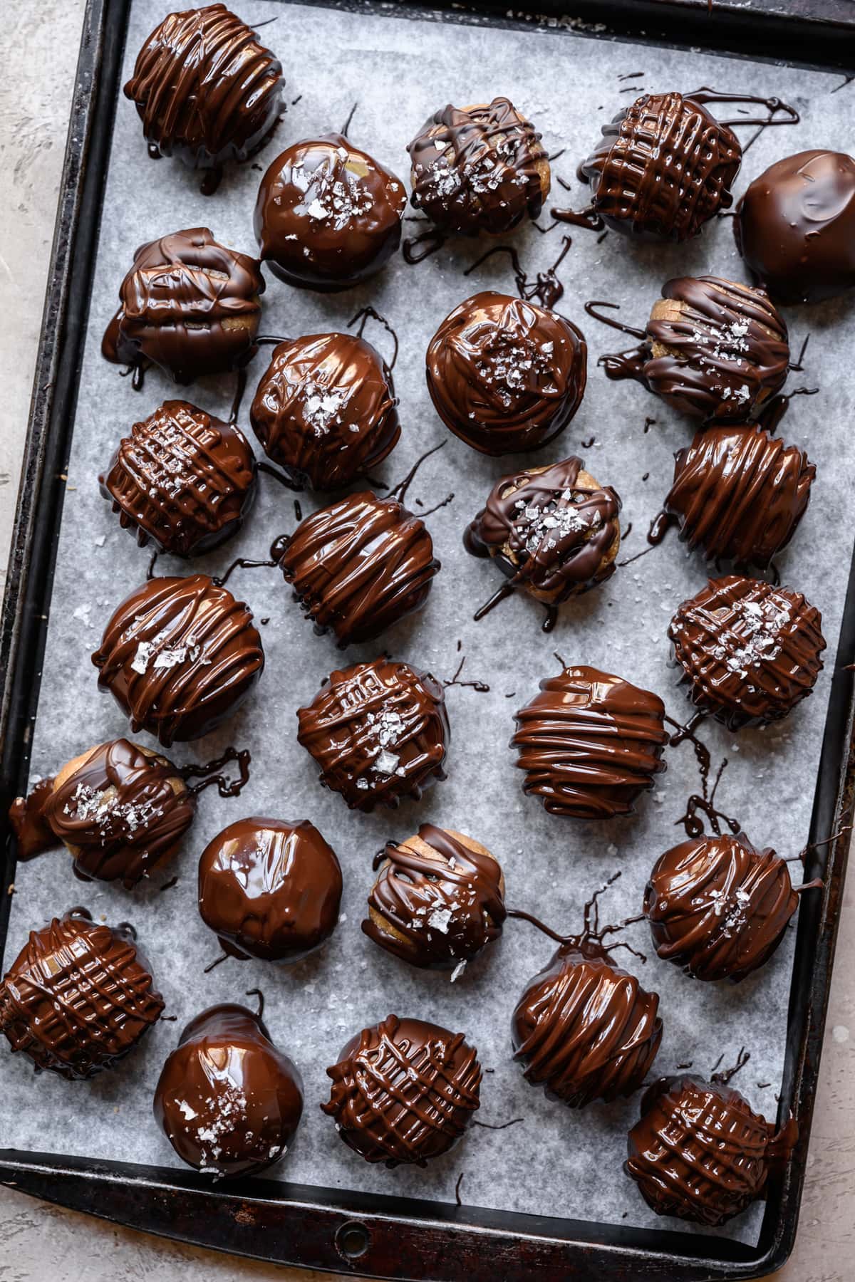 overhead view of tray filled with chocolate covered vegan cookie dough bites