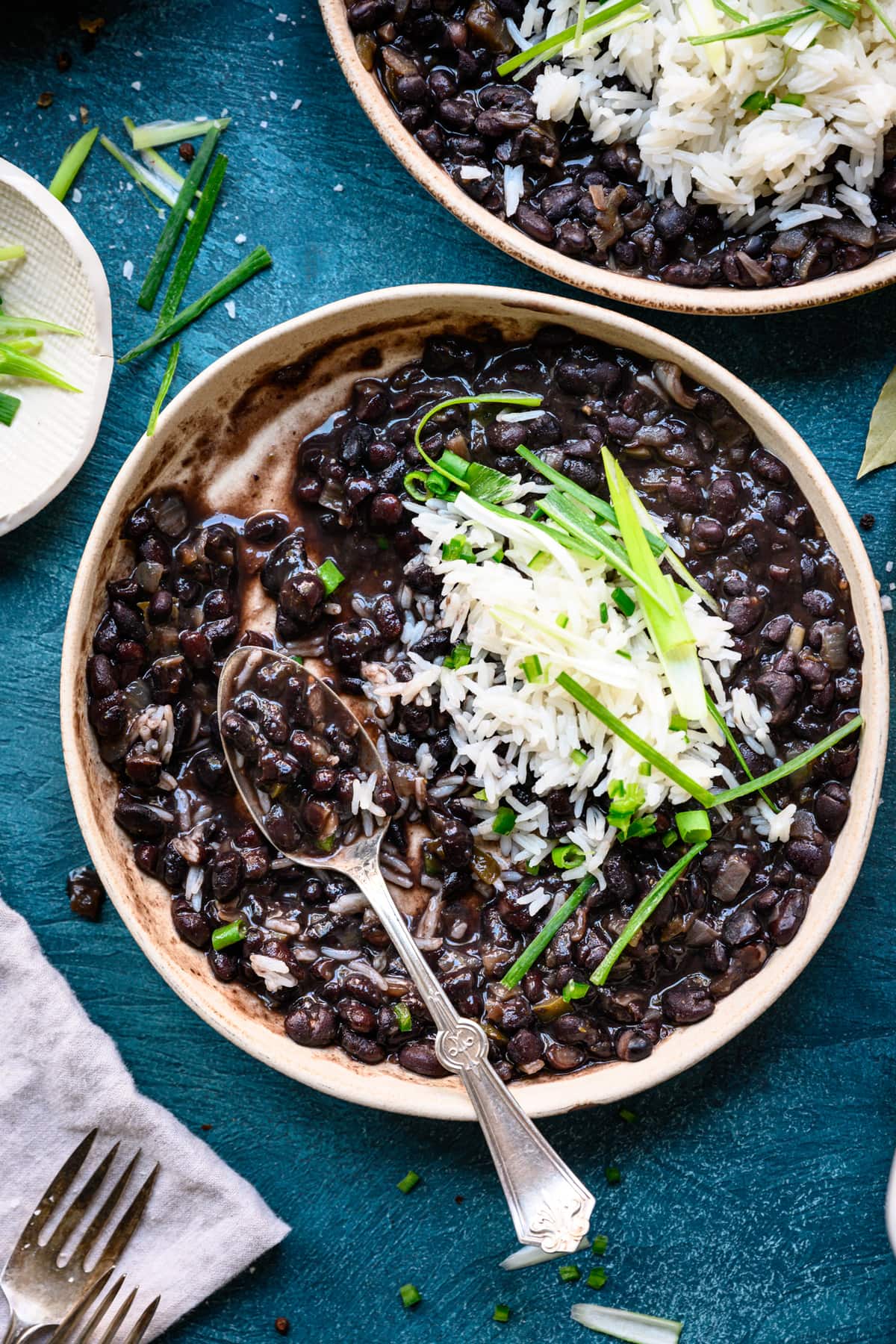 close up overhead of vegetarian cuban black beans in bowl with rice