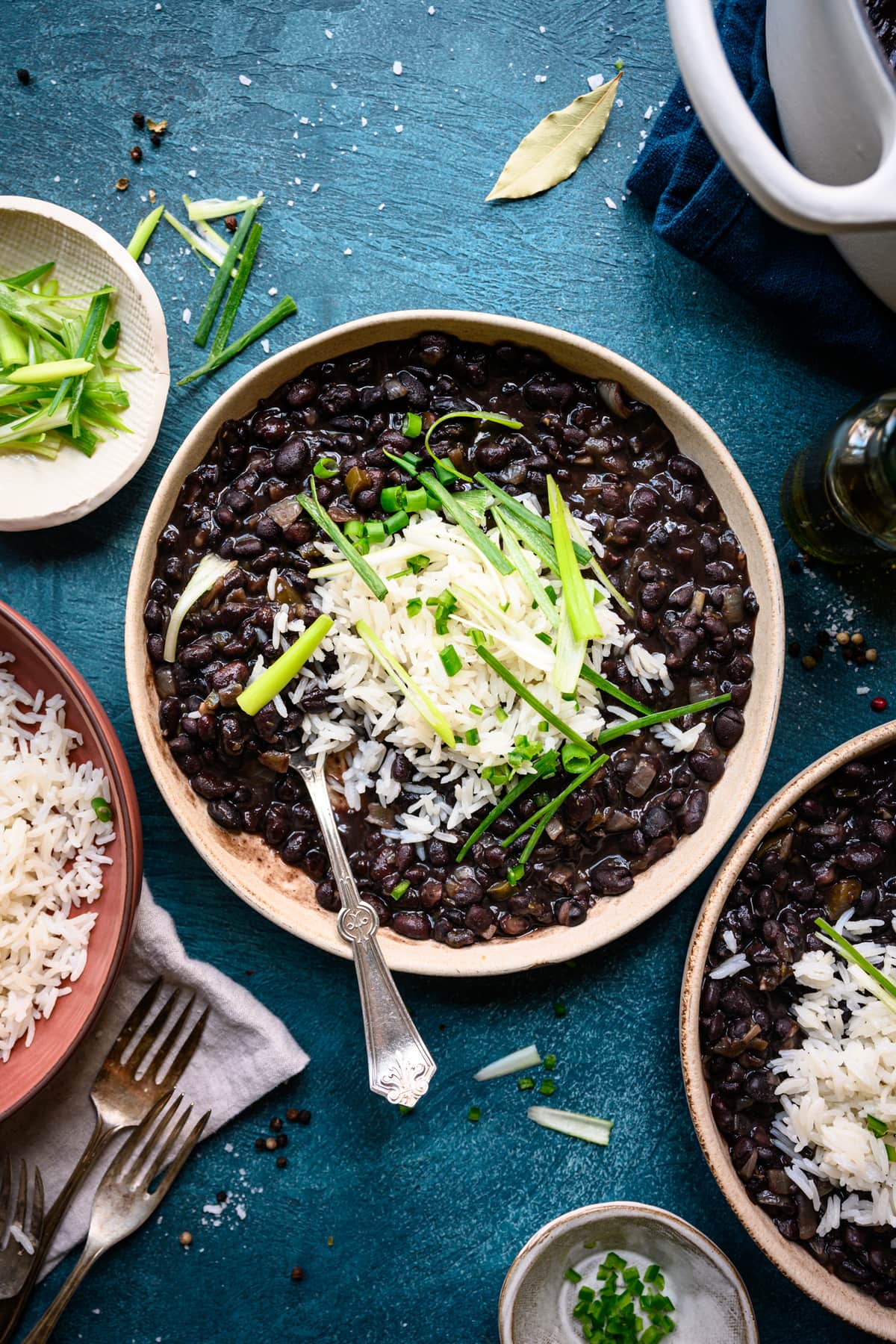 overhead view of vegan cuban black beans in bowls with rice