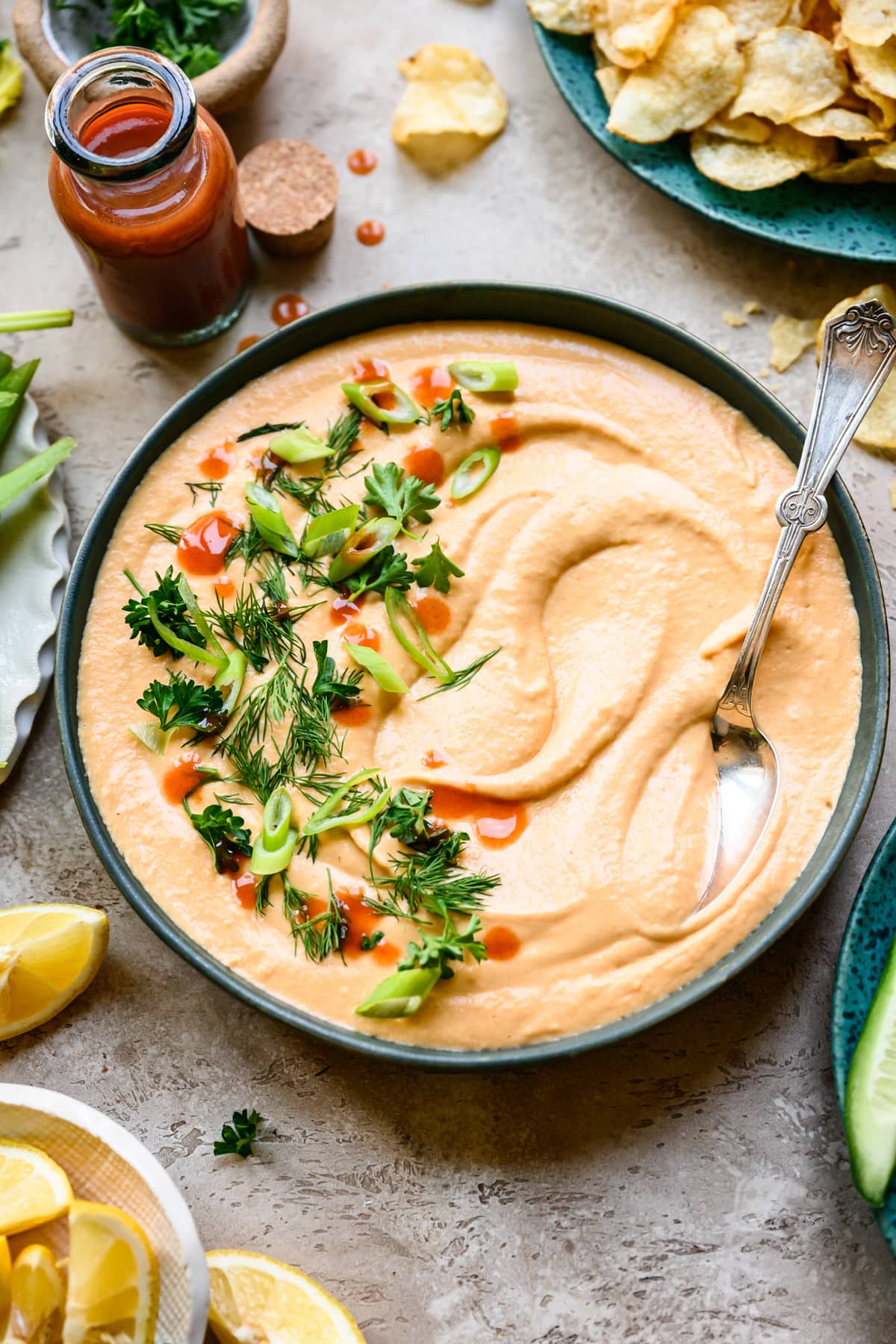 side view of vegan buffalo white bean dip in bowl