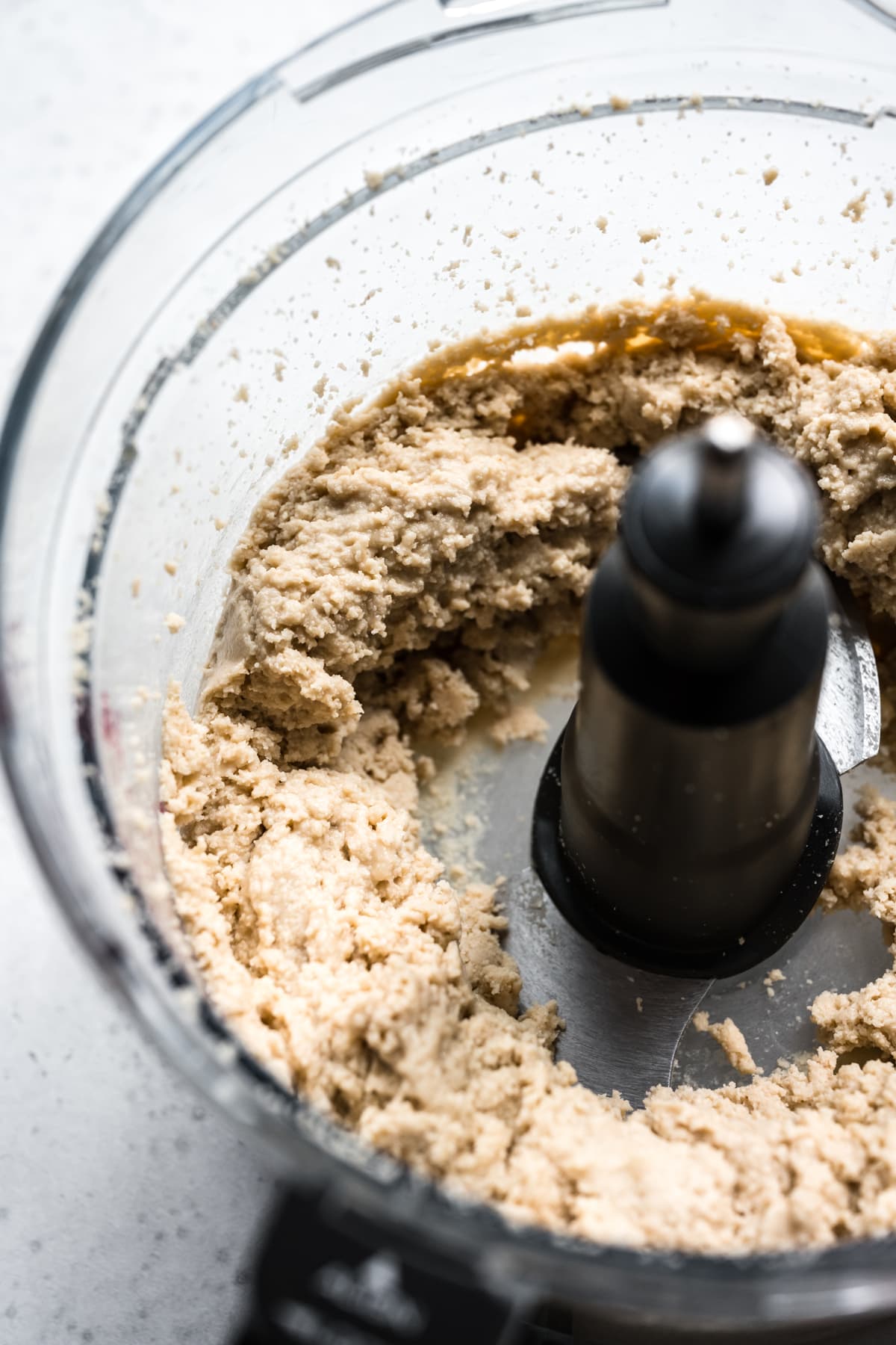 close up view of tahini paste in food processor