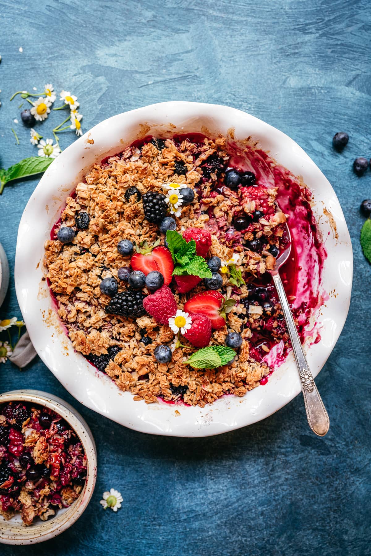 overhead view of vegan gluten free triple berry crisp with granola