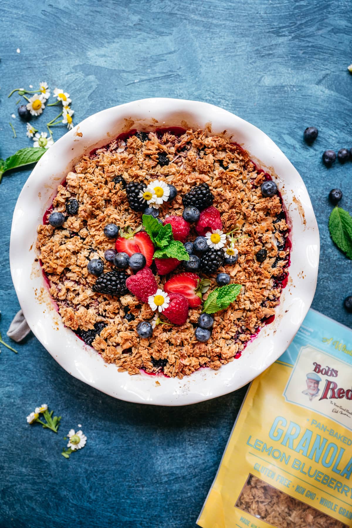 overhead view of vegan gluten free triple berry crisp with granola