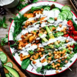 Buffalo cauliflower salad seen from above with ranch dressing on top.