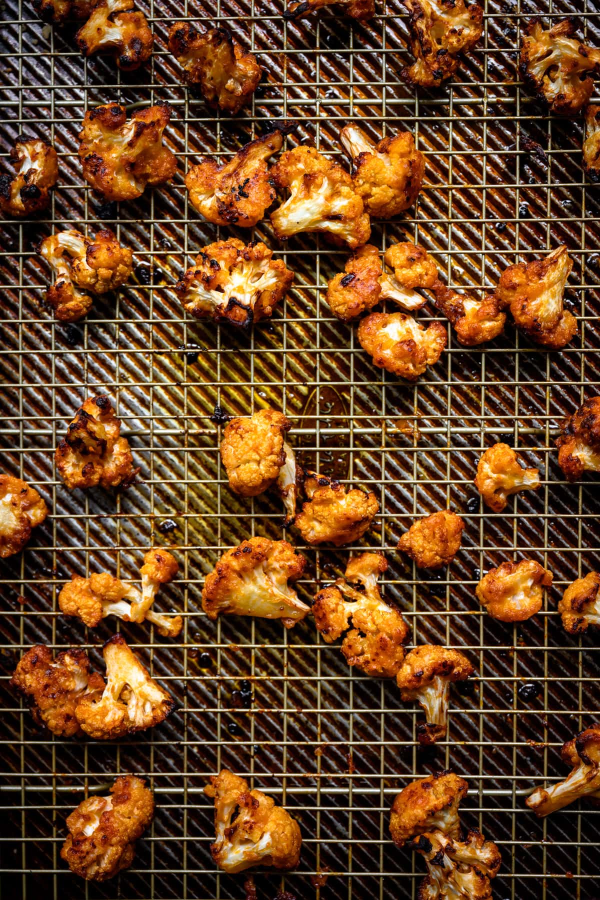 overhead view of roasted buffalo cauliflower on a sheet pan