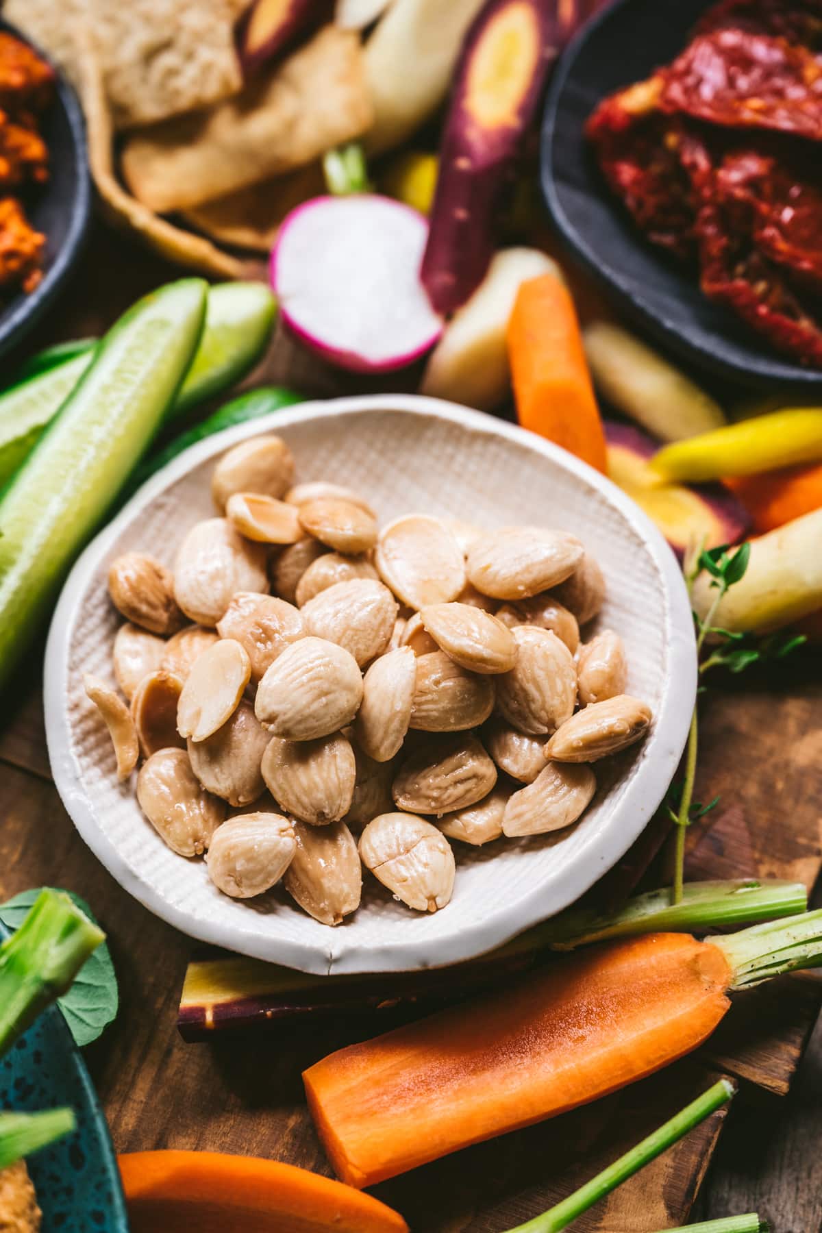 Marcona almonds in a small white bowl