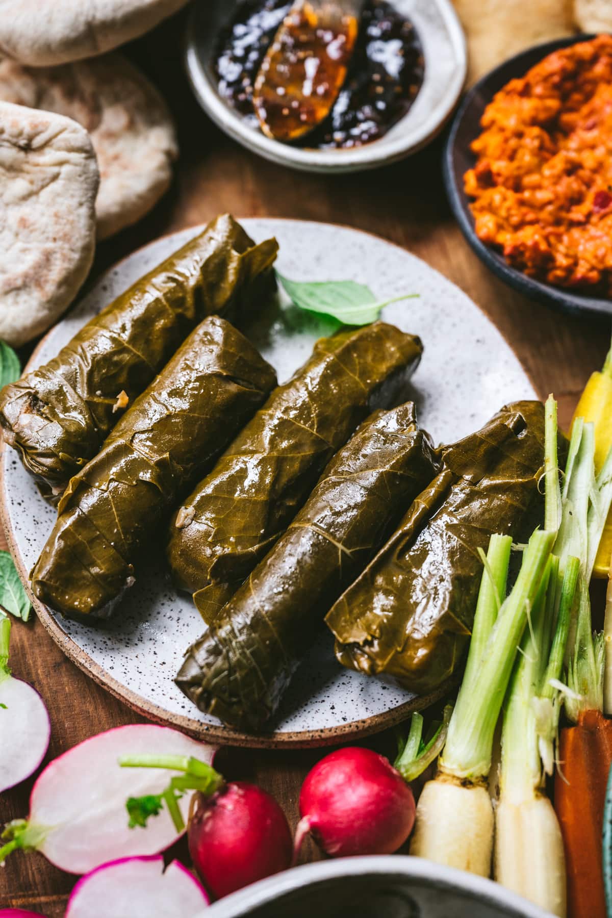 overhead view of grape leaves on plate