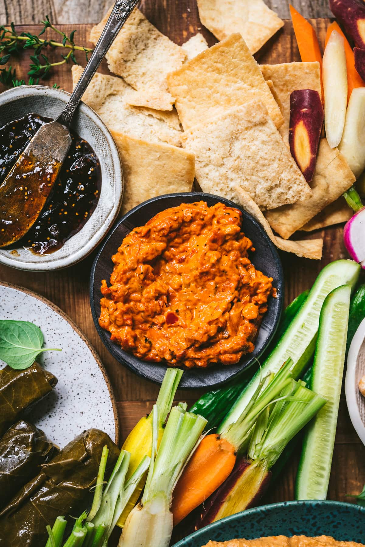 overhead view of red pepper dip on mezze platter