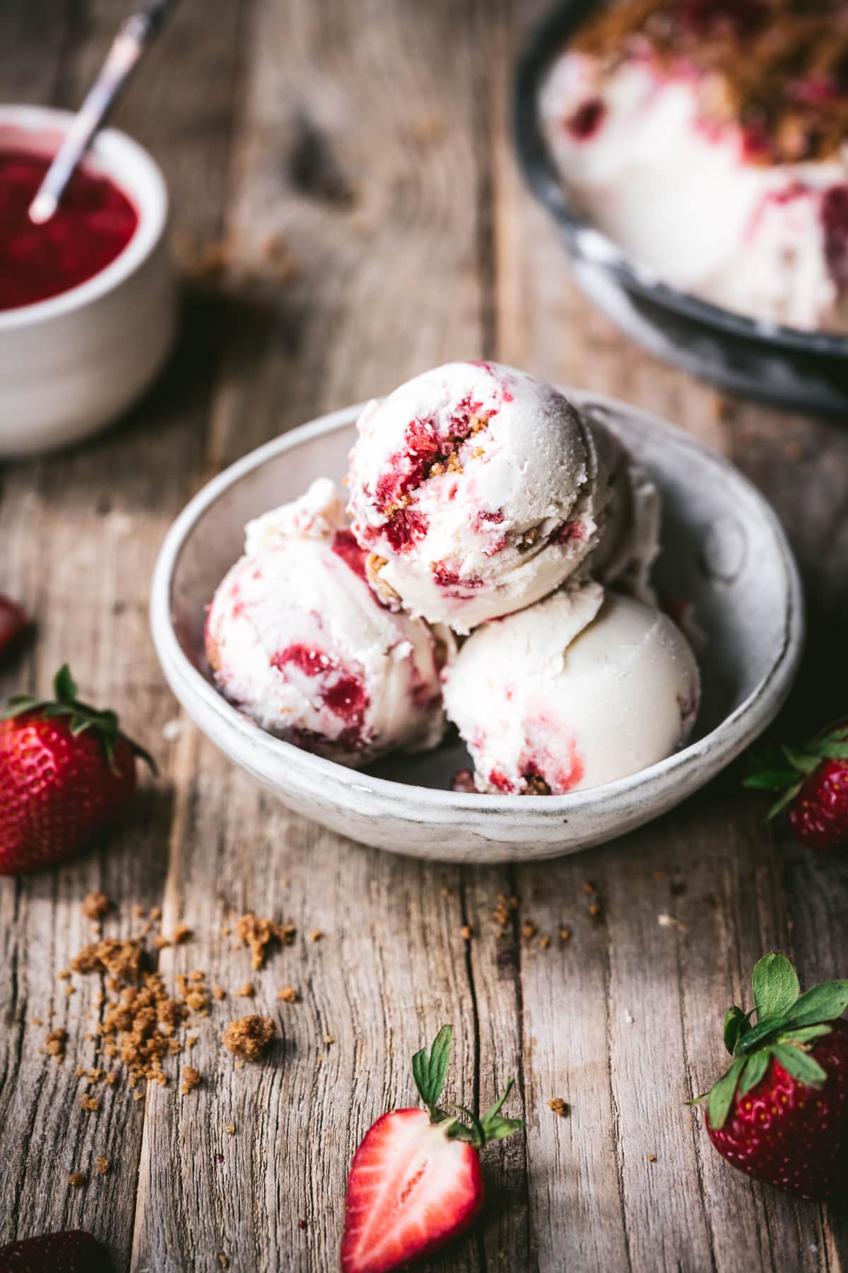 side view of strawberry cheesecake ice cream in bowl