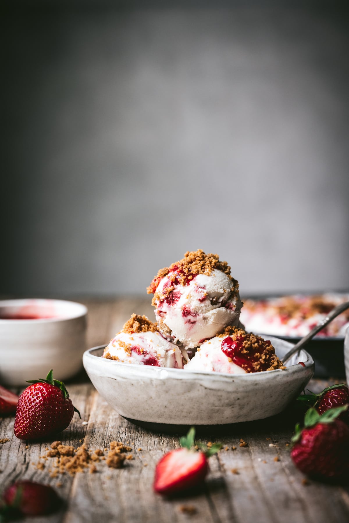 side view of vegan strawberry cheesecake ice cream in a bowl