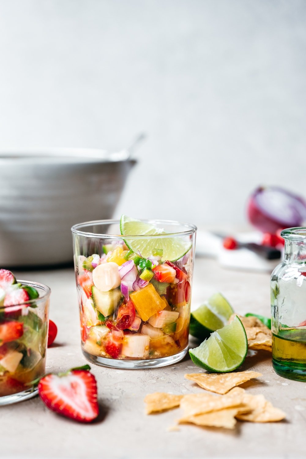 side view of vegan ceviche in a glass jar with lime slice