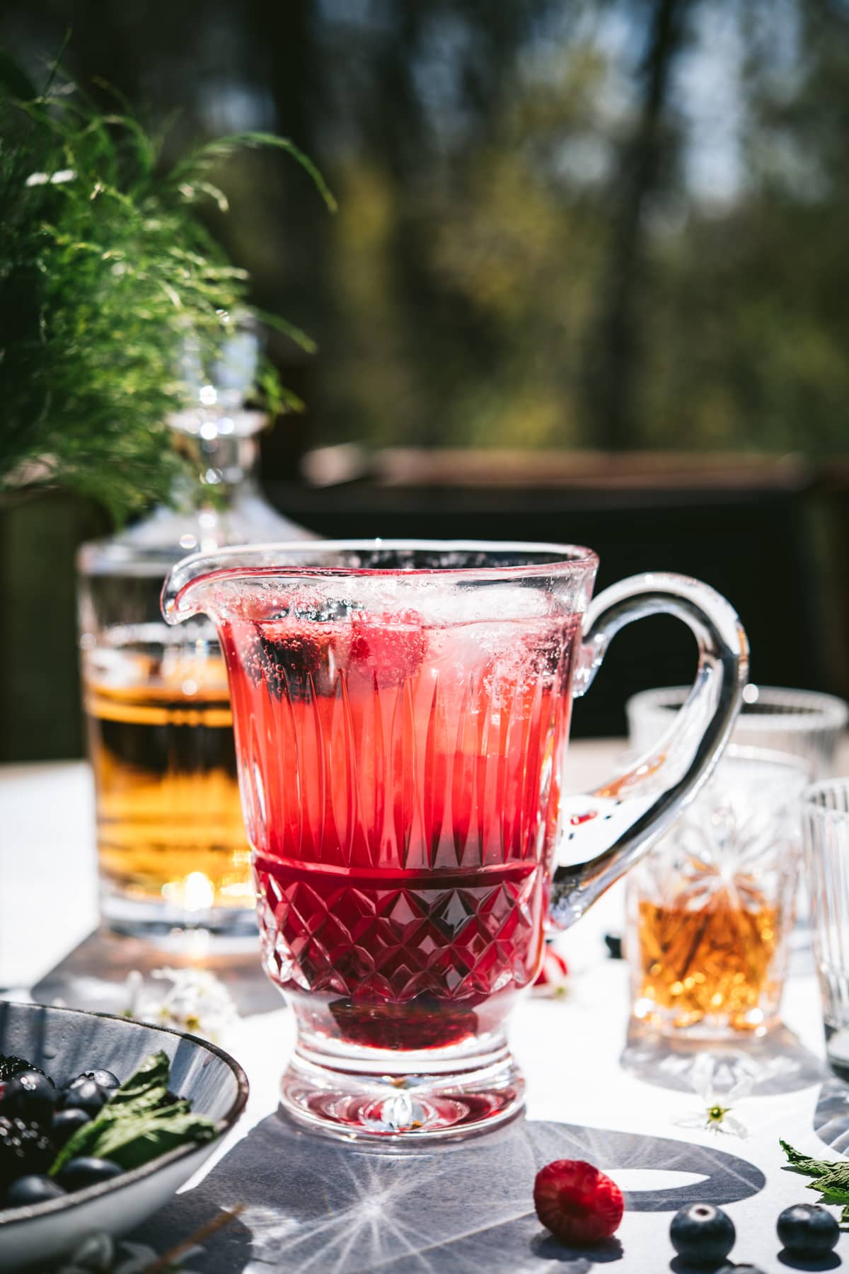 side view of summer bourbon berry pitcher cocktail