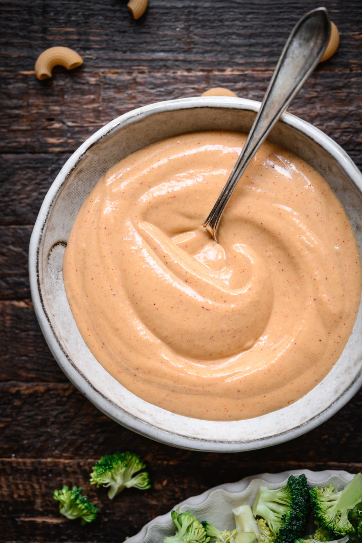 overhead view of spicy tahini mayo sauce for macaroni salad