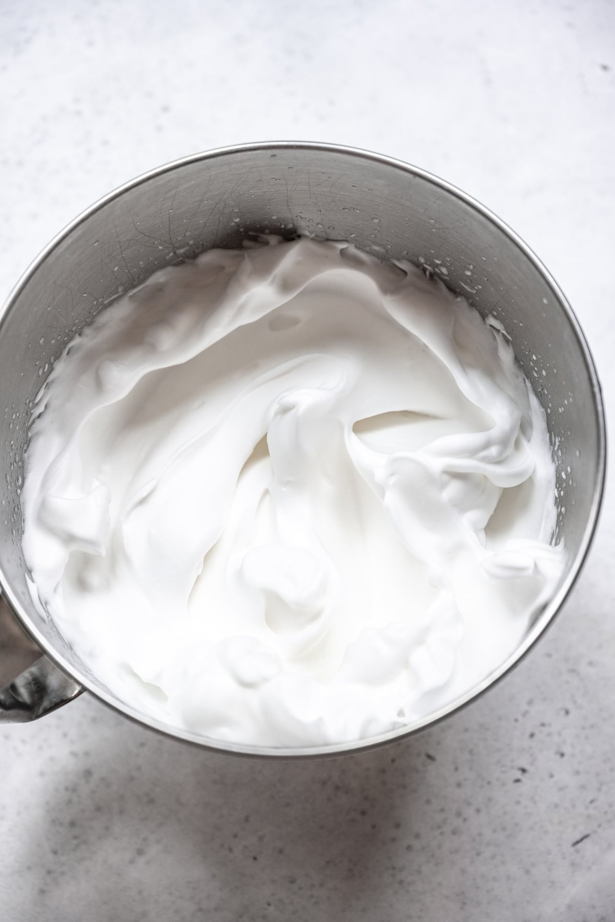 vegan aquafaba meringue in mixing bowl