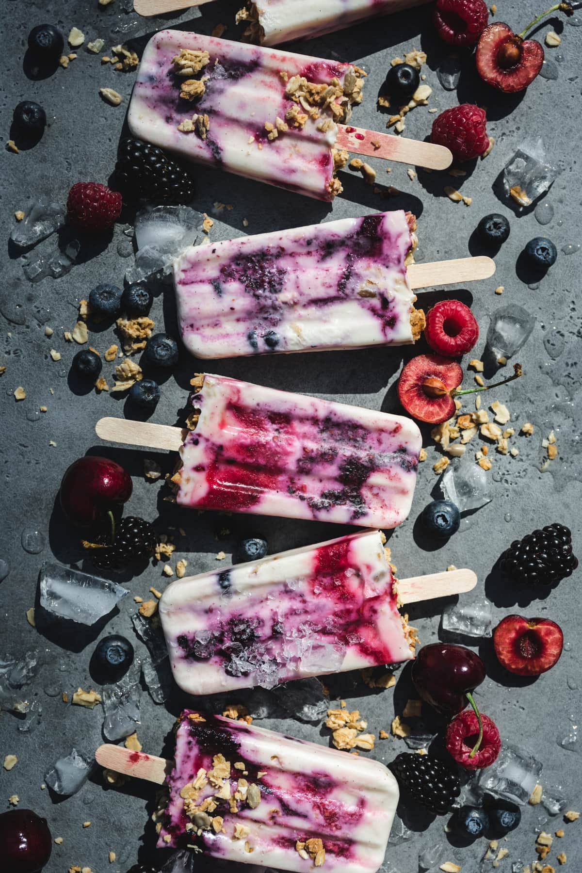 overhead view of vegan yogurt berry breakfast popsicles with berries