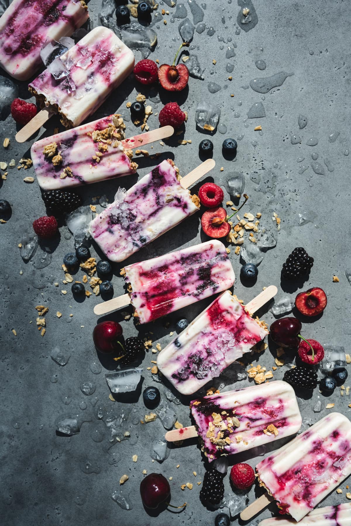 overhead view of vegan yogurt berry breakfast popsicles with berries