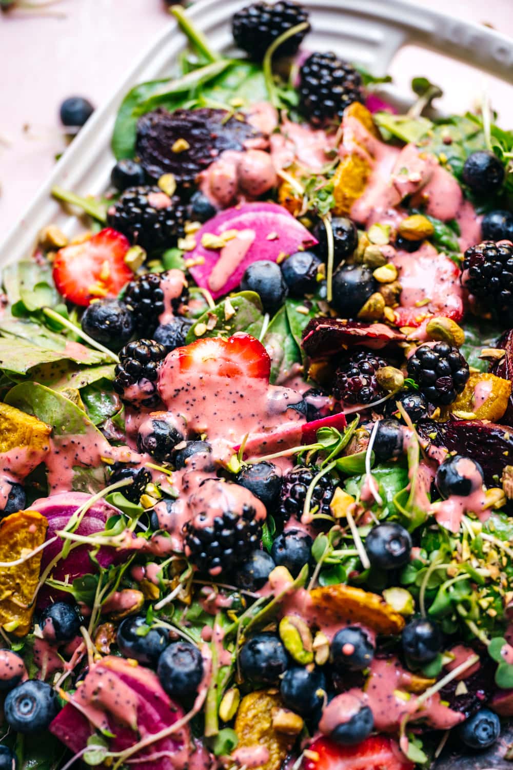 close up view of roasted beet berry salad with strawberry poppy seed dressing