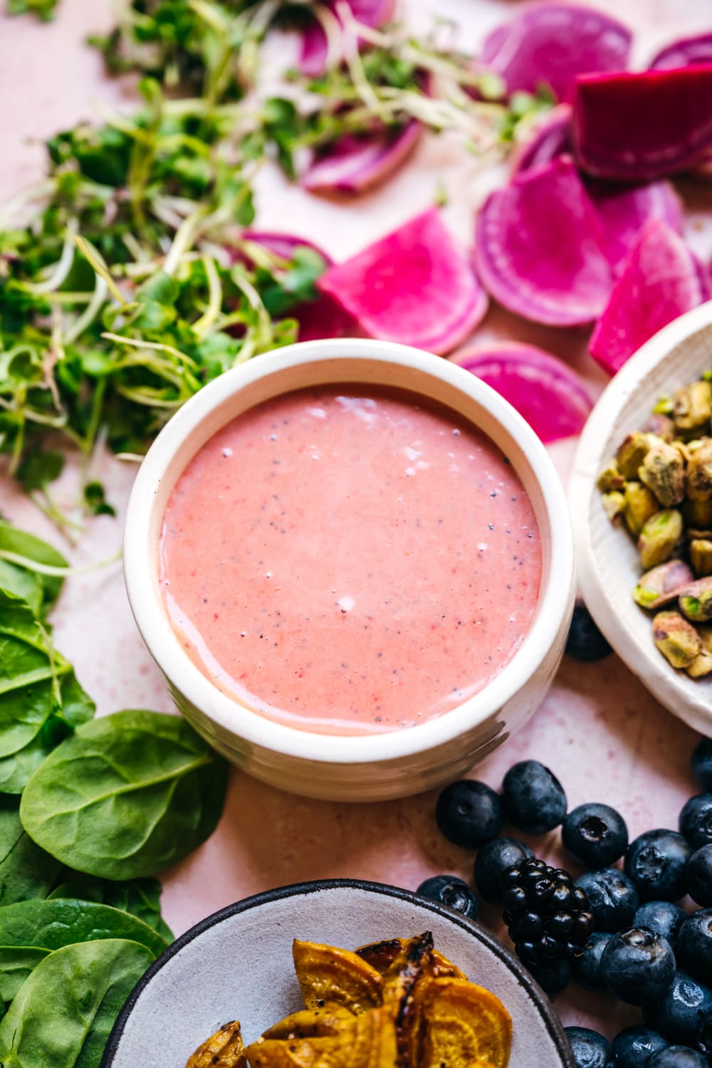 close up of strawberry poppy seed dressing in a bowl