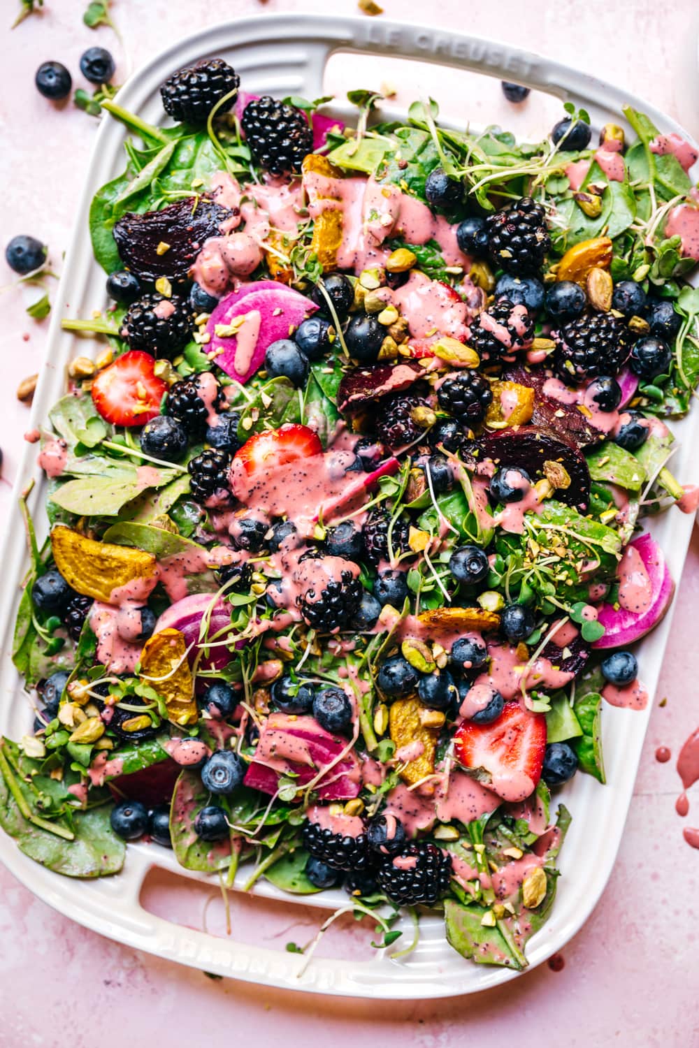 overhead view of roasted beet berry salad on a platter