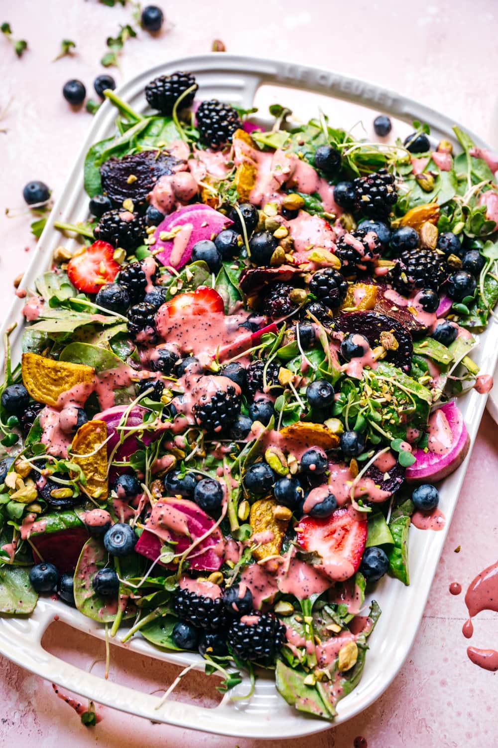 overhead view of roasted beet berry salad on a platter