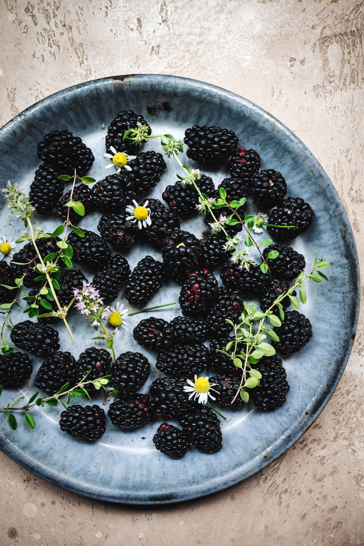 overhead view of blackberries in a shallow bowl