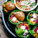 Collard green wrap from above with peanut sauce.