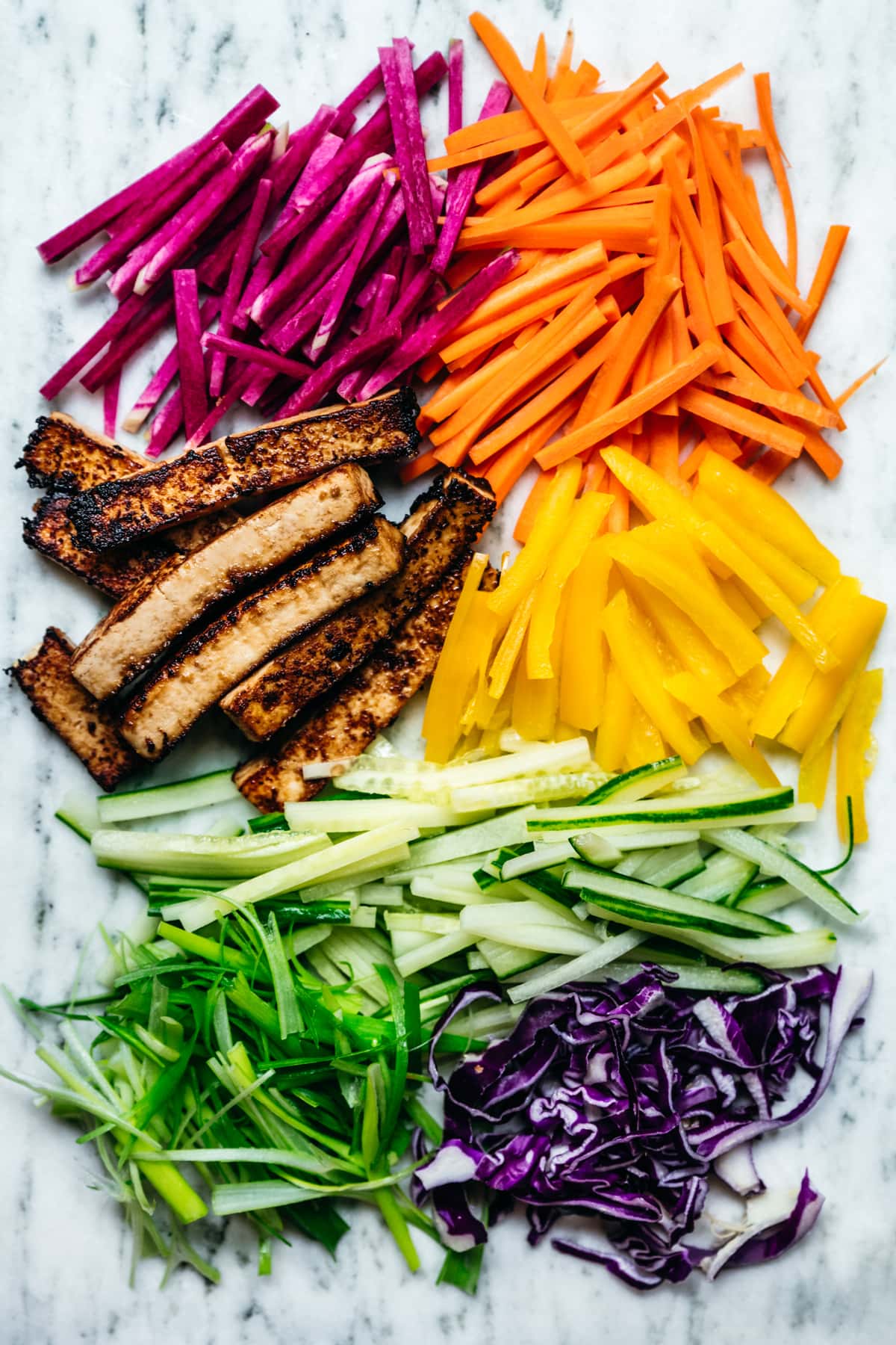 overhead view of colorful raw vegetables prepared for wraps