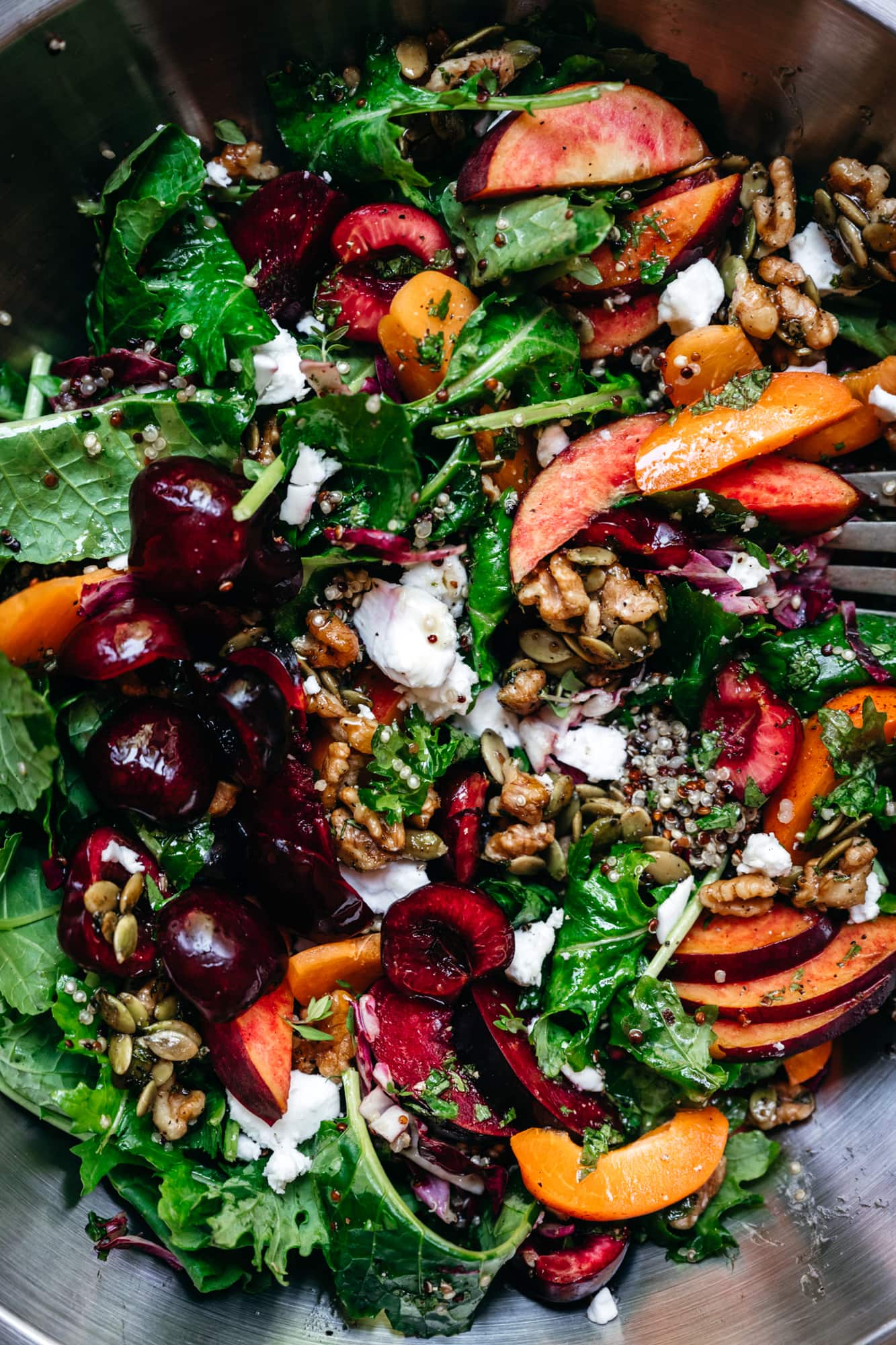 overhead view of stone fruit salad in a bowl