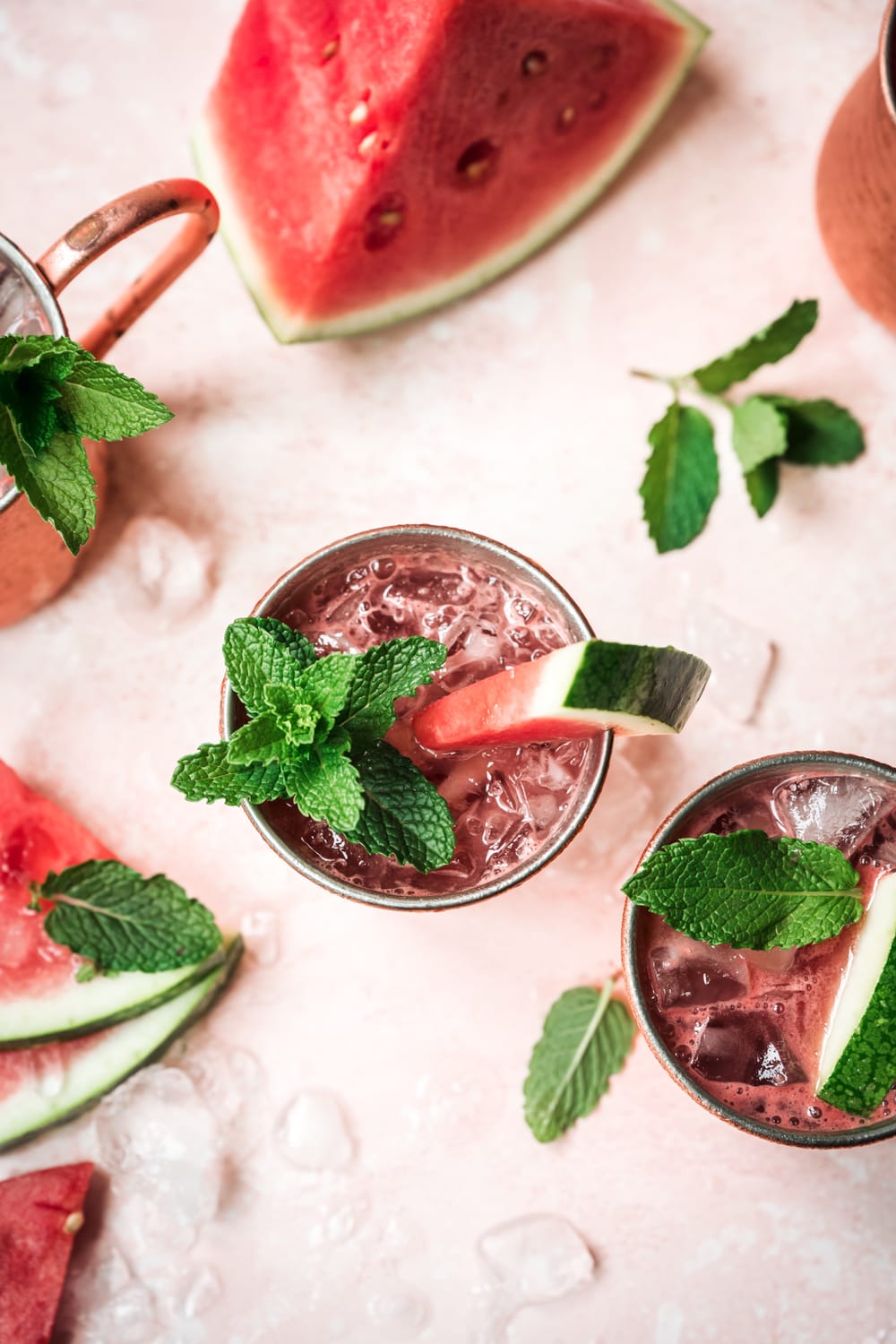 side view of watermelon moscow mule in copper mug with mint garnish