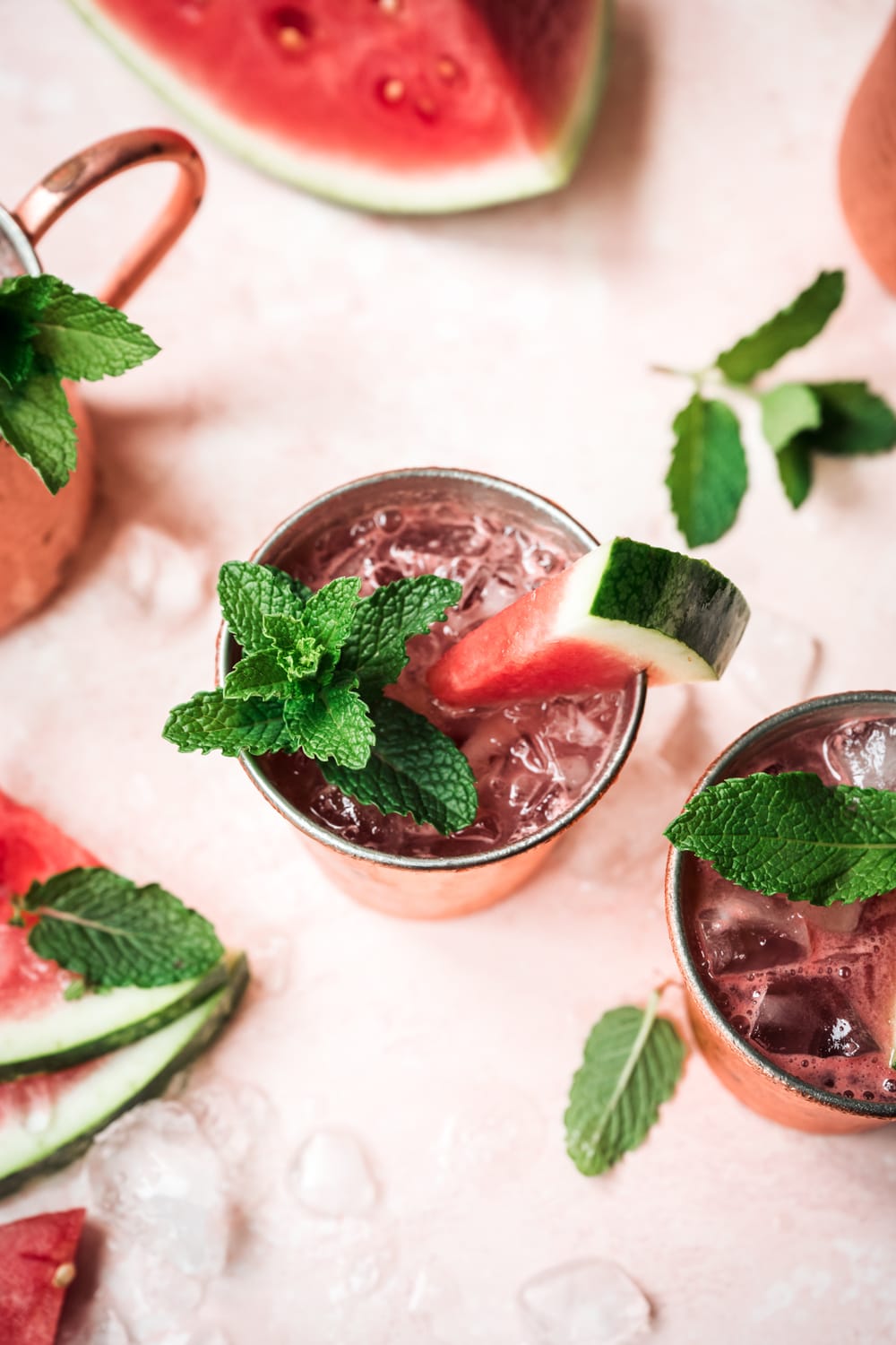 side view of watermelon moscow mule in copper mug with mint garnish