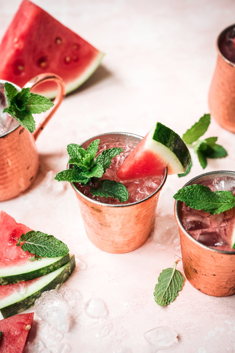 side view of watermelon moscow mule in copper mug with mint garnish