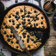 overhead of gluten free blueberry cornbread in a skillet