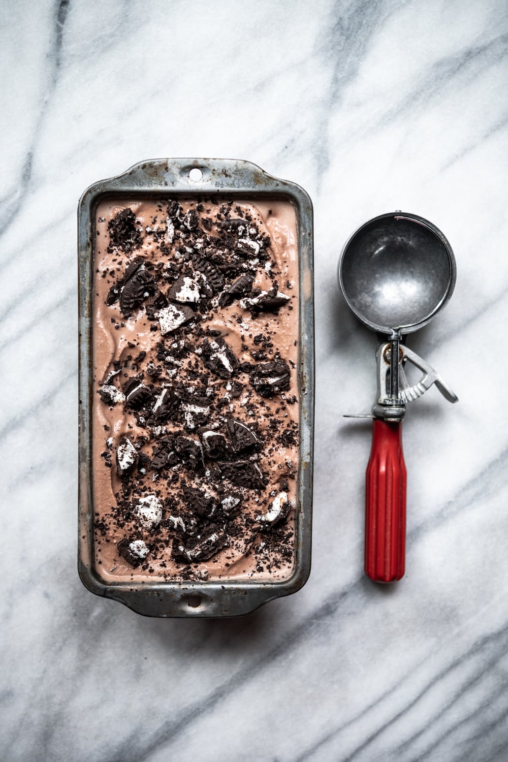 overhead view of tin of chocolate cookies and cream ice cream