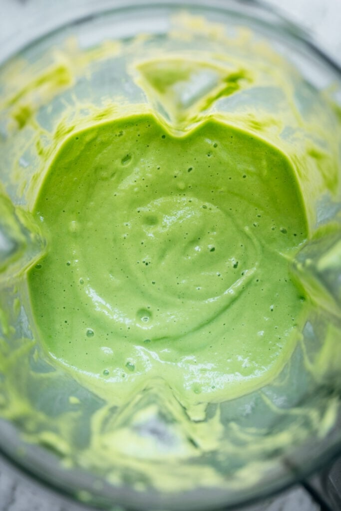 overhead view of cucumber avocado gazpacho in blender
