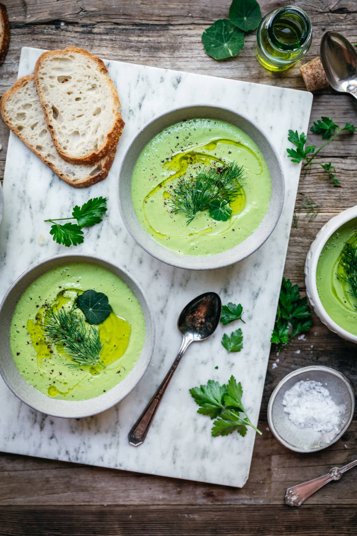 overhead view of vegan cucumber avocado gazpacho in bowls