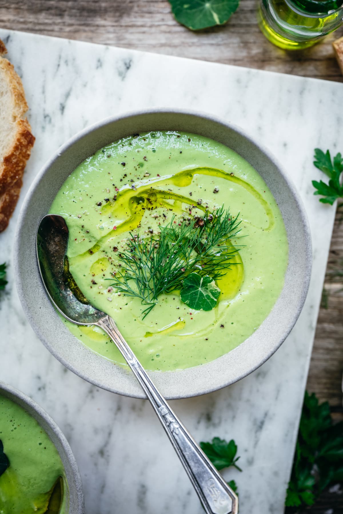 overhead view of vegan cucumber avocado gazpacho in bowls