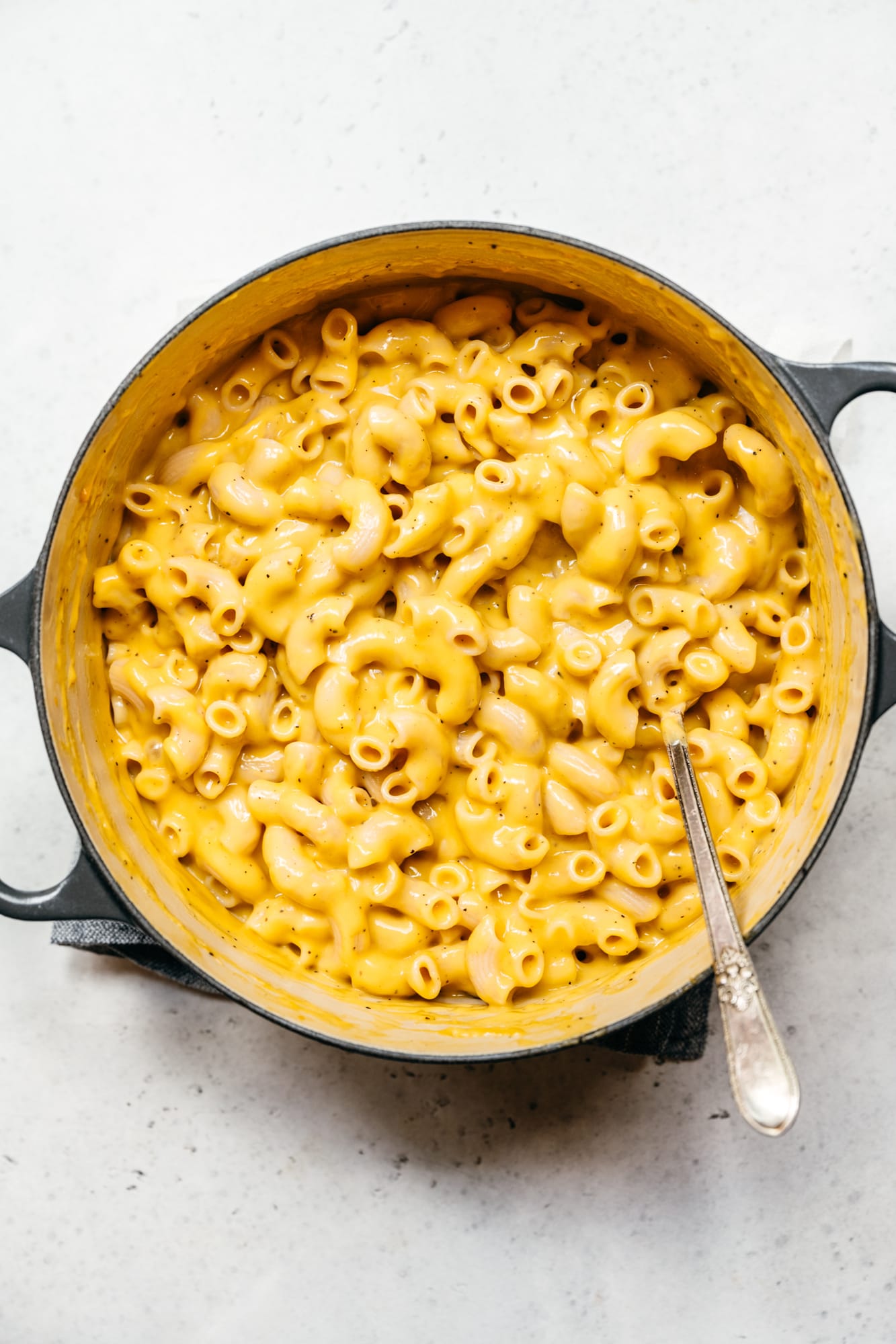 overhead view of creamy vegan mac and cheese in large pot